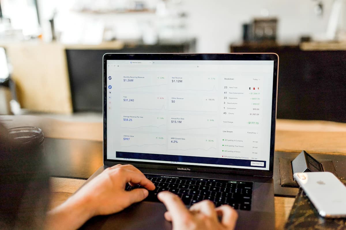 A merchant managing orders on a laptop